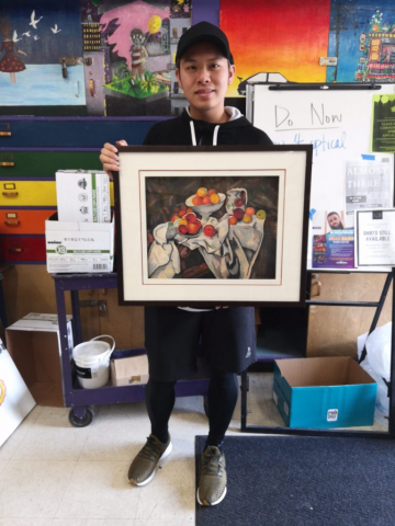 Senior Tim Xu stands with his first place piece titled "Oil Pastel Drawing of Fruits".